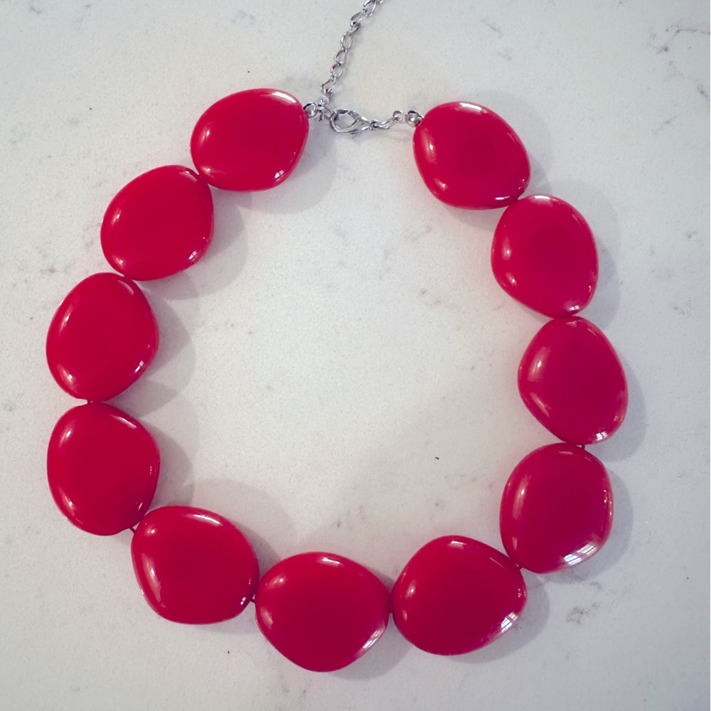 Red, chunky statement necklace.